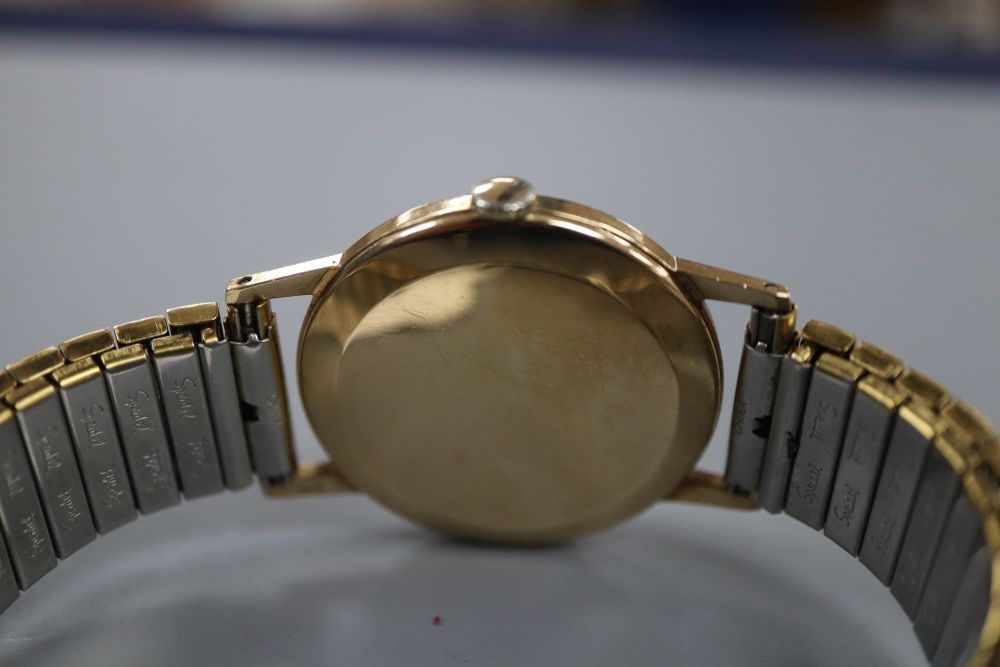 A gentlemans 1960s? 9ct gold Cyma manual wind wrist watch, on later associated bracelet.